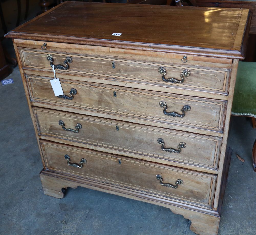 An Edwardian Georgian style mahogany chest with brushing slide and four graduated long drawers, on bracket feet, width 87cm